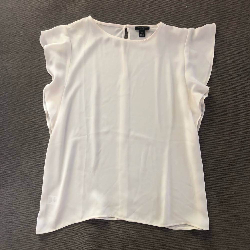 White blouse with flutter sleeves